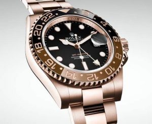 The 40 mm fake Rolex GMT-Master II 126715HNR watches have black dials.