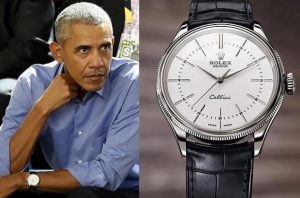 Ex-president Barack Obama wears the white dial watch fake Rolex Cellini 50509 with black leather strap.
